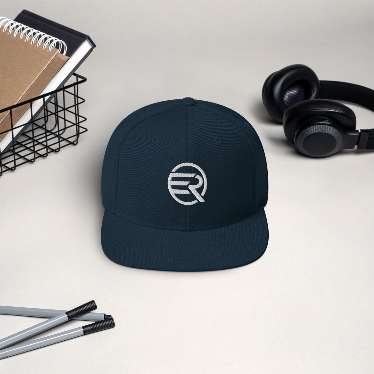 ER Signature Snapback Cap featuring a structured six-panel crown and flat brim