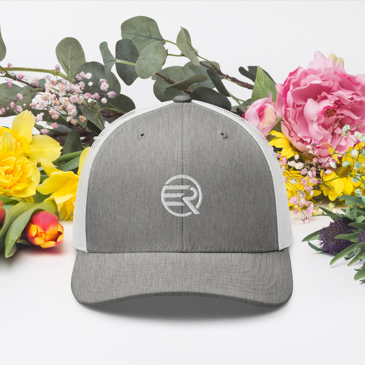ER Signature Trucker Cap with embroidered Eddy Ratty branding and breathable mesh back